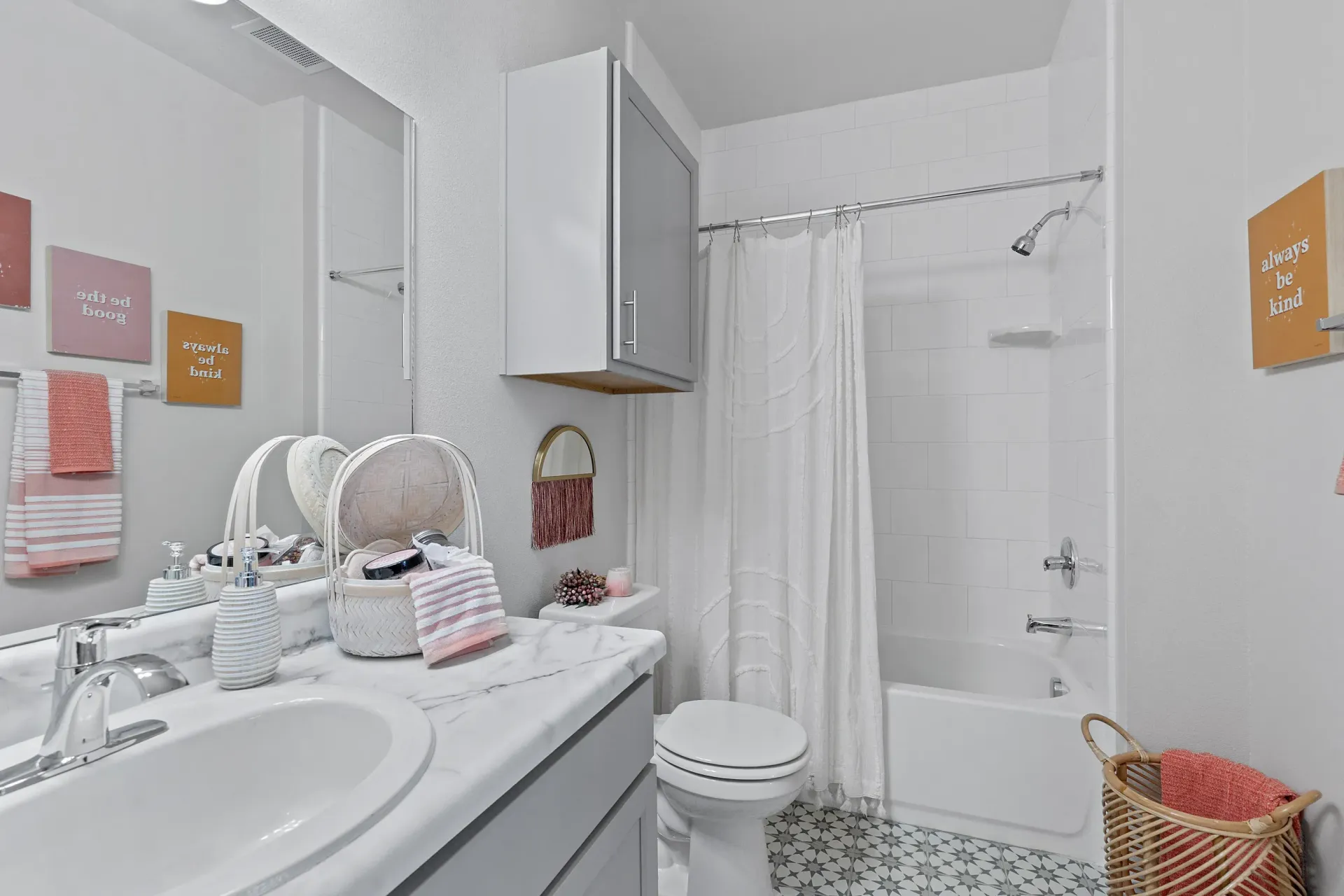 Modern bathroom with a tub and decorative accents.