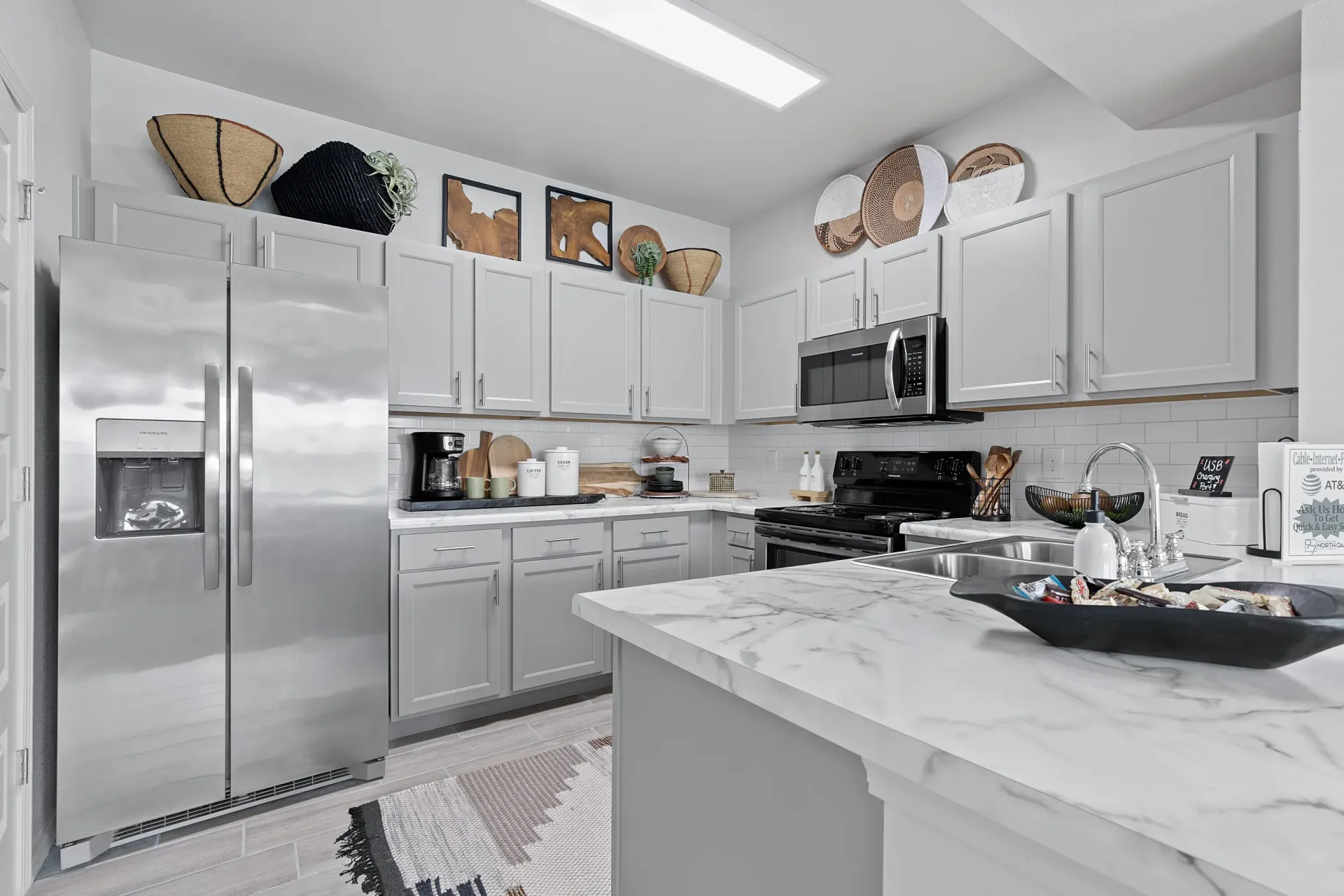 Modern bathroom with stainless steel appliances and marble counter