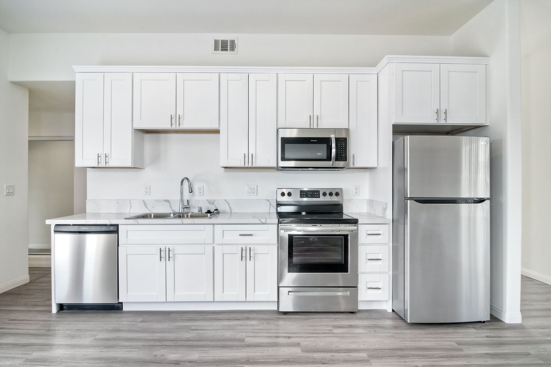 Photo of a kitchen with appliances set in a single row