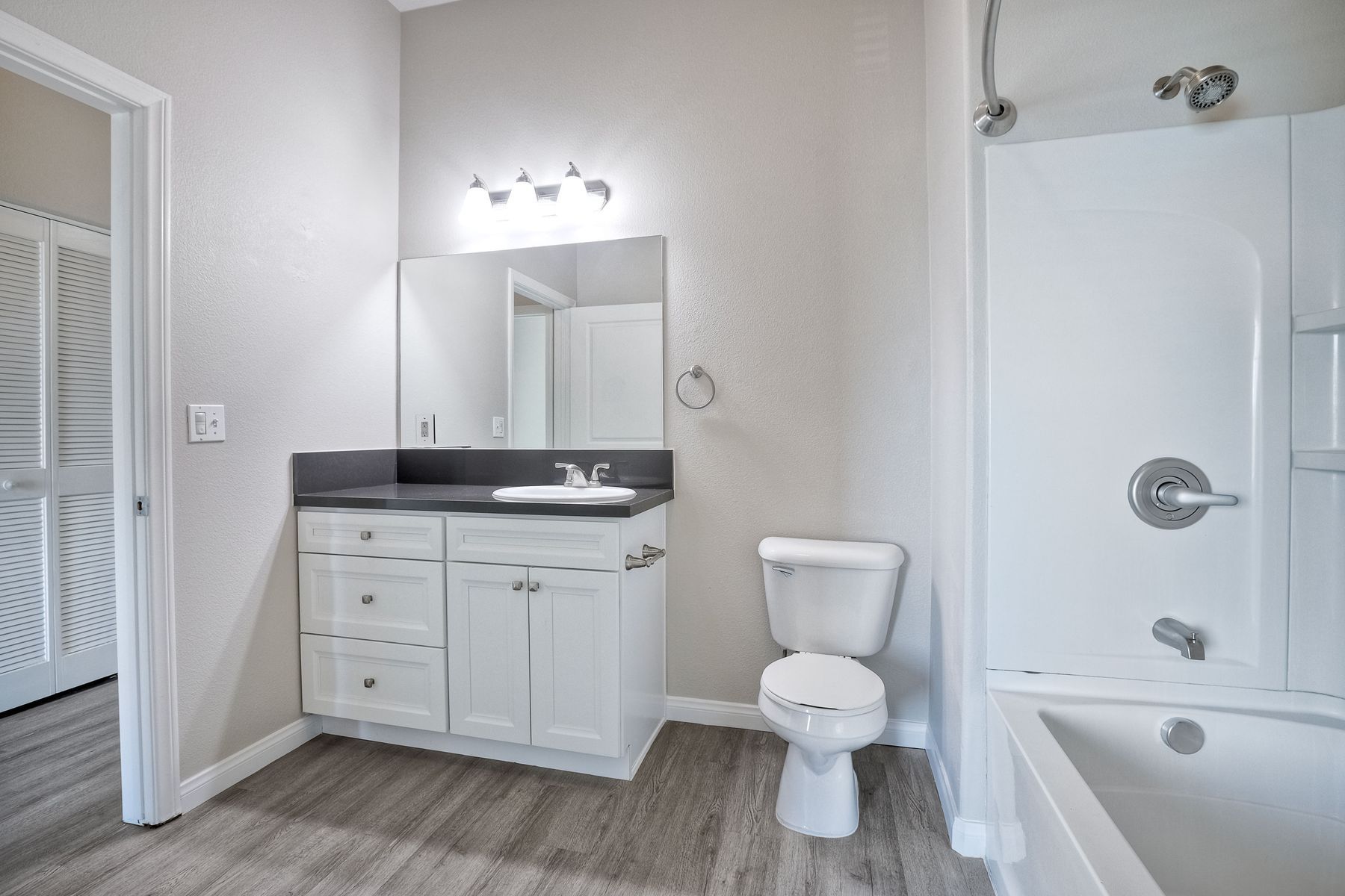 Photo of a bathroom with a shower/tub combo