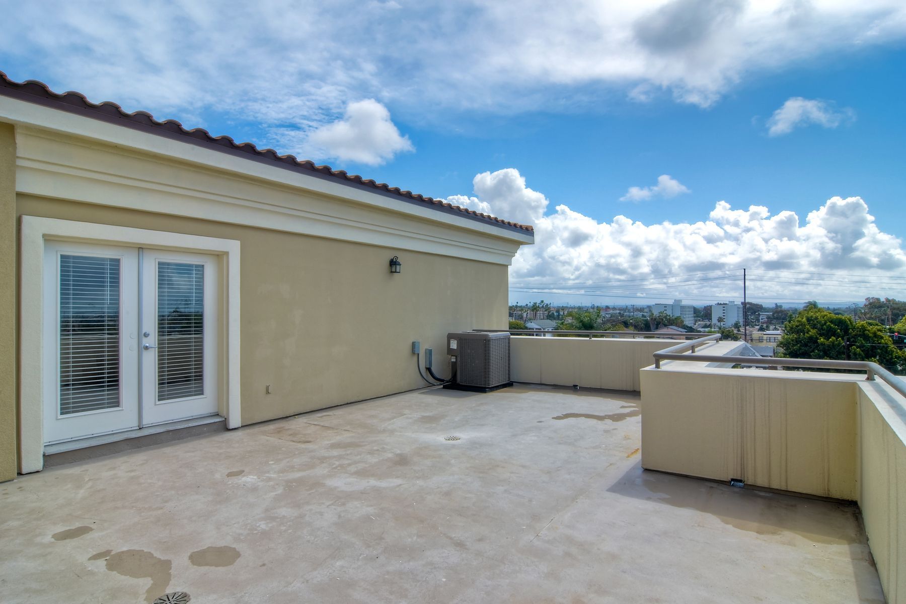 Photo of a rooftop area showing the building doors that lead to this area
