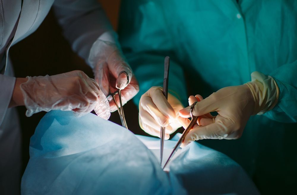 Two Surgeons Are Operating on a Patient in an Operating Room — ACT Law Associates In Fyshwick, ACT