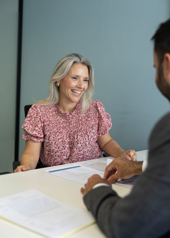 A Man in a Suit is Posing for a Headshot — ACT Law Associates In Canberra, ACT