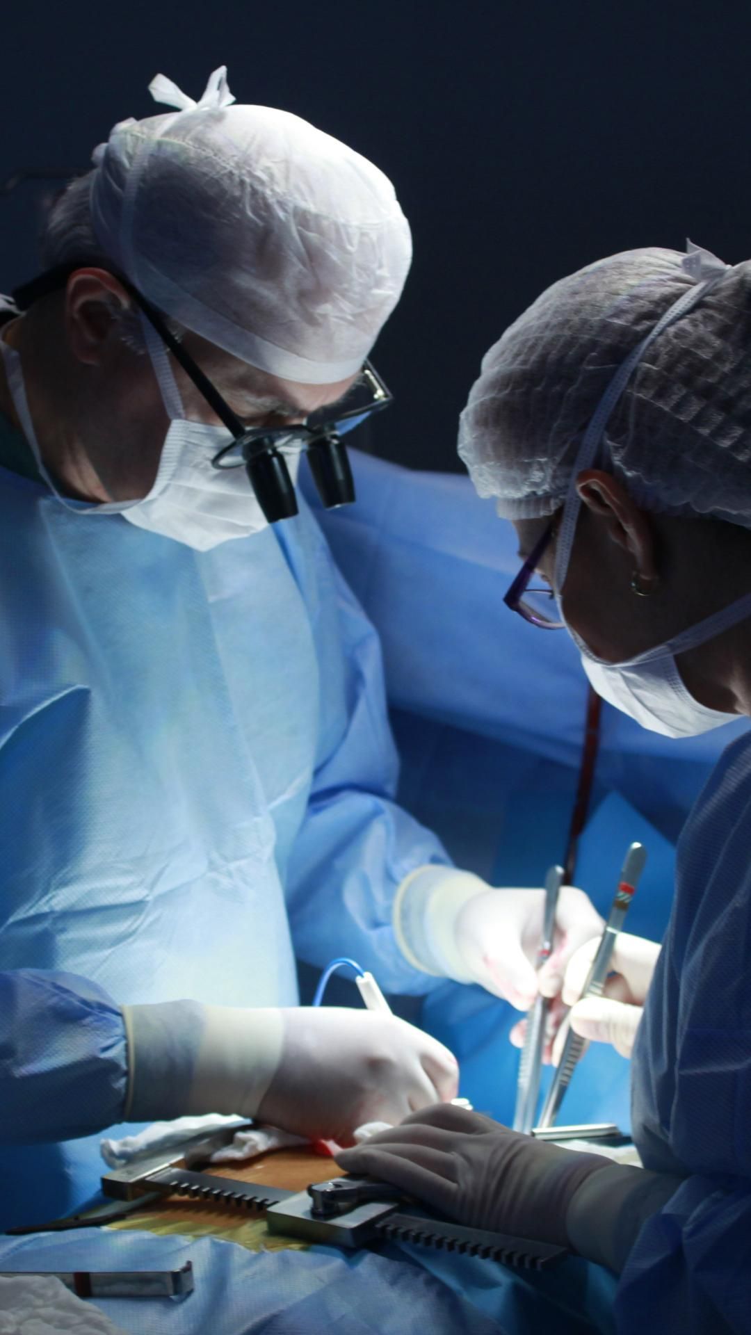 Two Surgeons Are Operating on a Patient in an Operating Room — ACT Law Associates In Belconnen, ACT