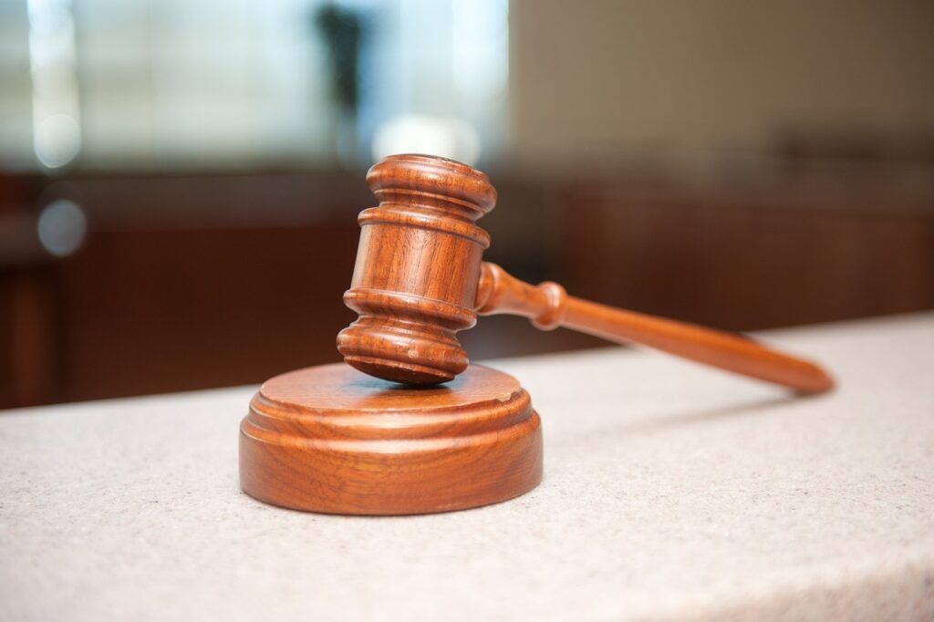 A Wooden Judge 's Gavel Is Sitting On A Counter — ACT Law Associates In Canberra, ACT
