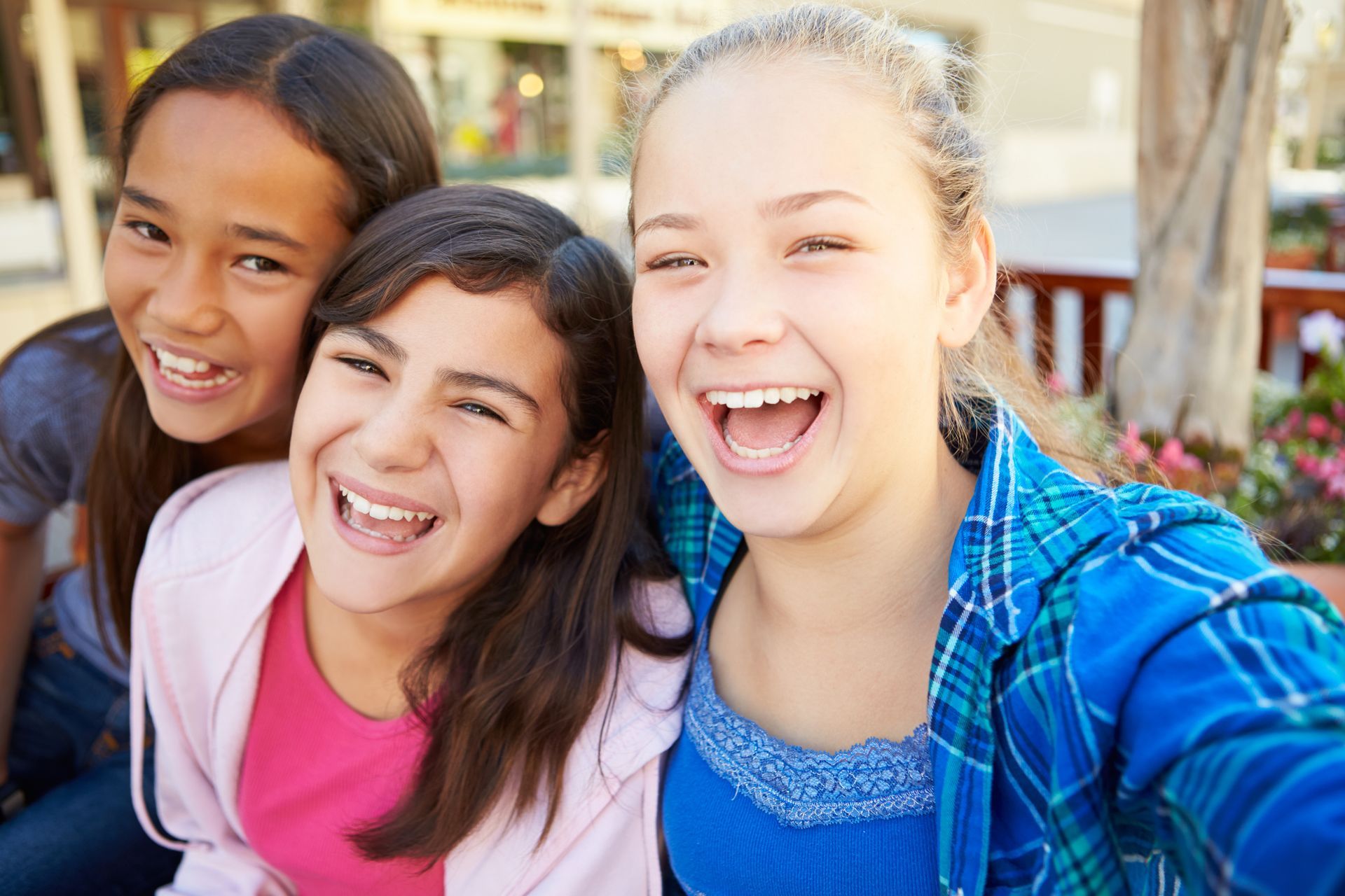 Group of kids smiling and taking a selfie photo together