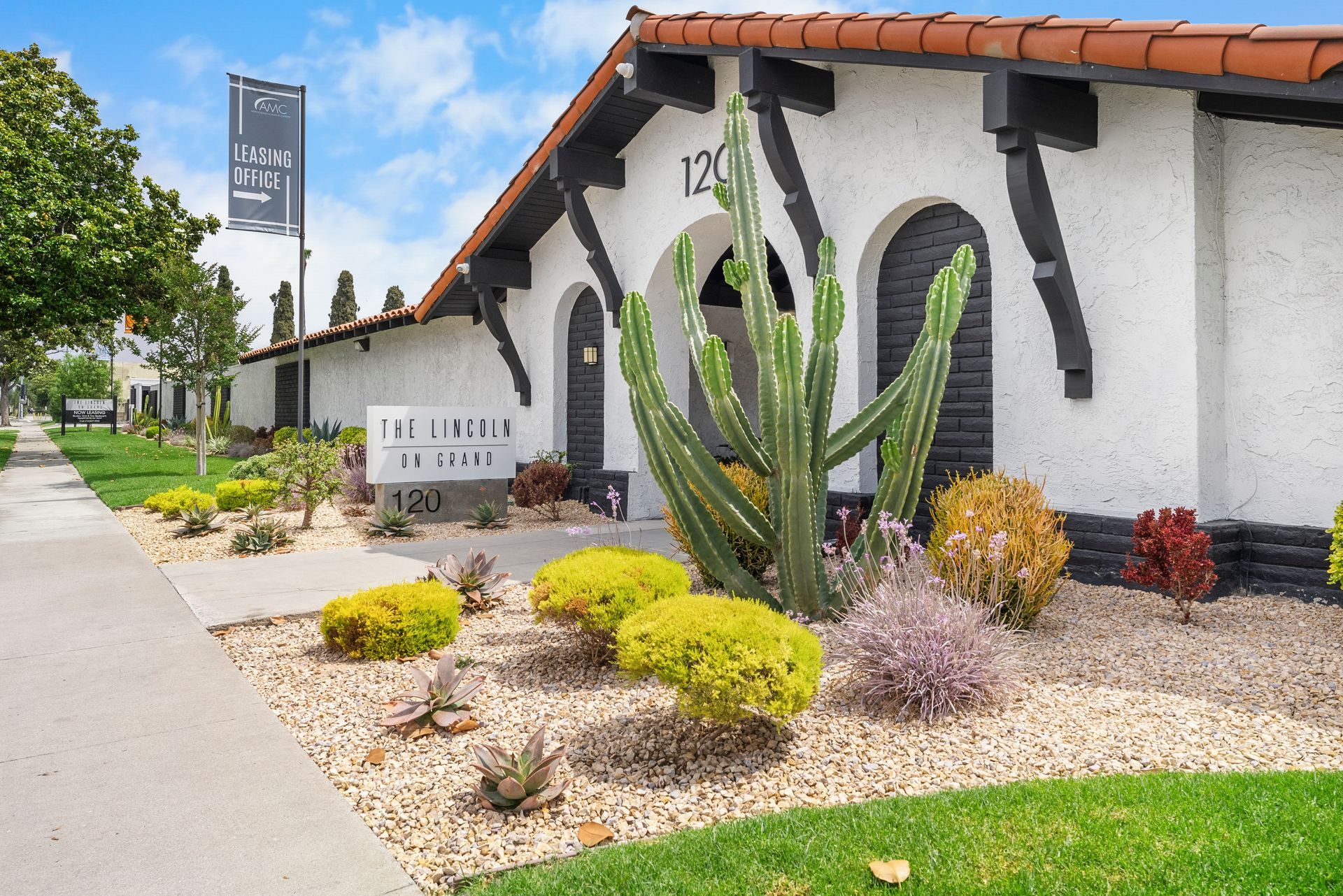 Entrance with cactus and monument sign