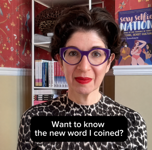 Leora Tanenbaum wearing leopard-print top and purple glasses with text saying, 