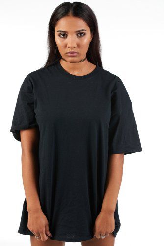 Young woman wearing oversized shirt.