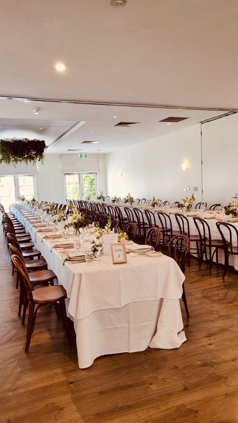 There Are a Lot of Tables and Chairs in The Room