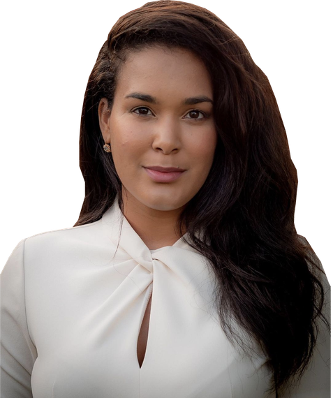 A woman with long dark hair is wearing a white shirt