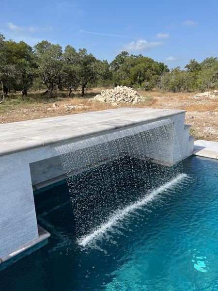 Waterfall feature in pool