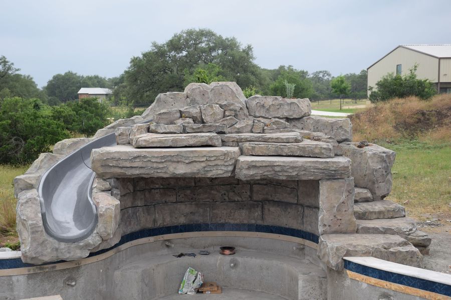 Swimming pool grotto with slide