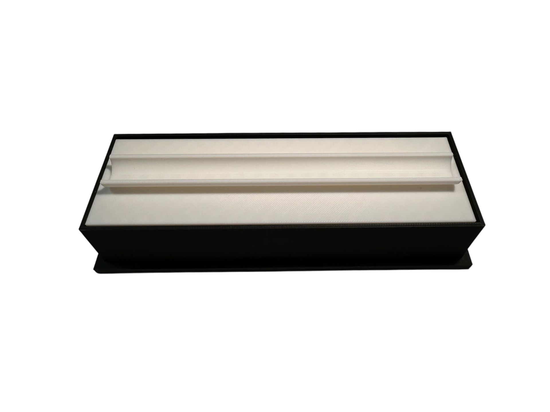 Black jewelry box with an open top revealing a white interior and a divider.