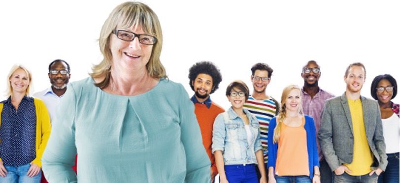 Group of diverse people smiling, standing together against a white background.