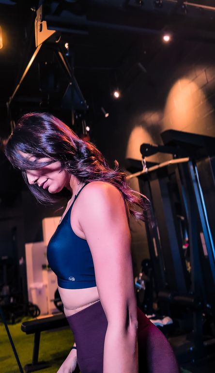 Female personal trainer guiding a beginner workout at Mahila gym Brampton