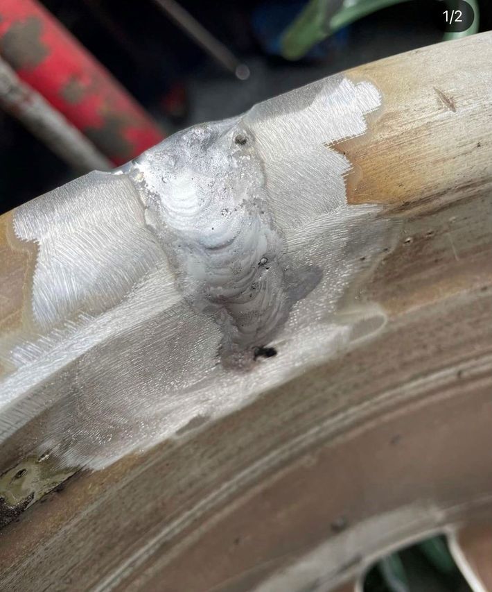 A close up of a wheel with a hole in it.