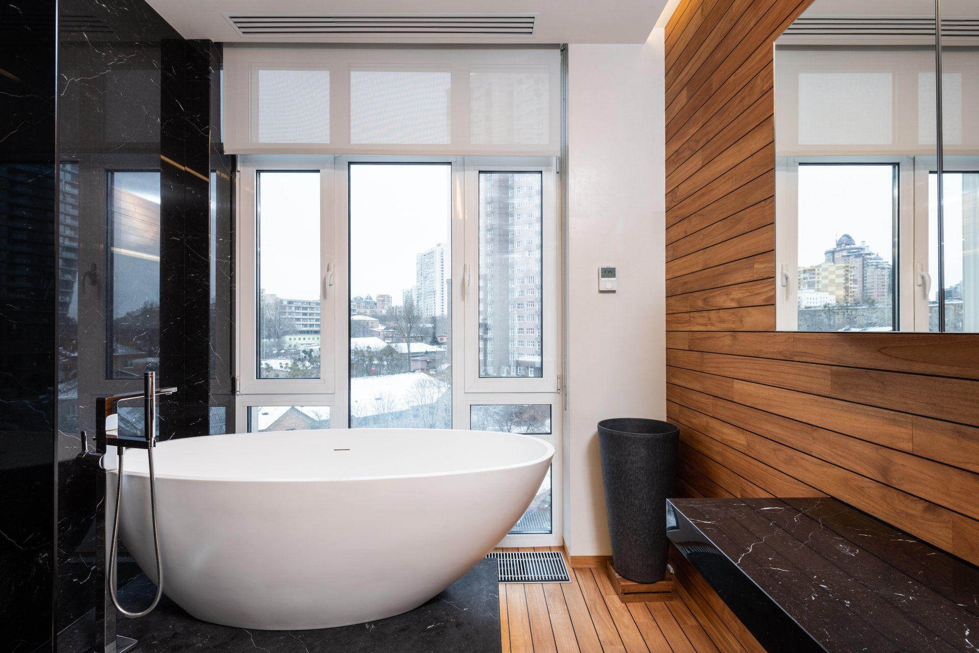 a bathroom makeover with a large tub and a large window: The Ultimate Guide to a Bathroom Makeover 2024.