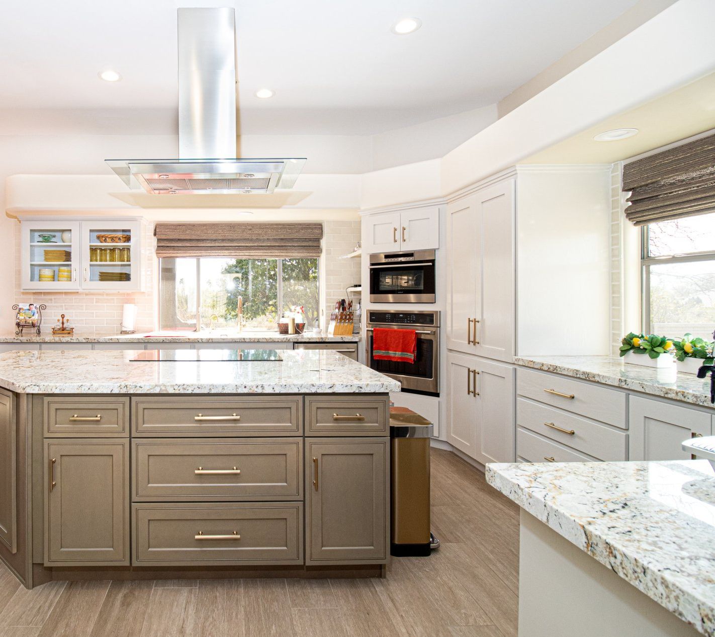 a kitchen with a large island and a stov oven . Transform Your Kitchen on a Budget