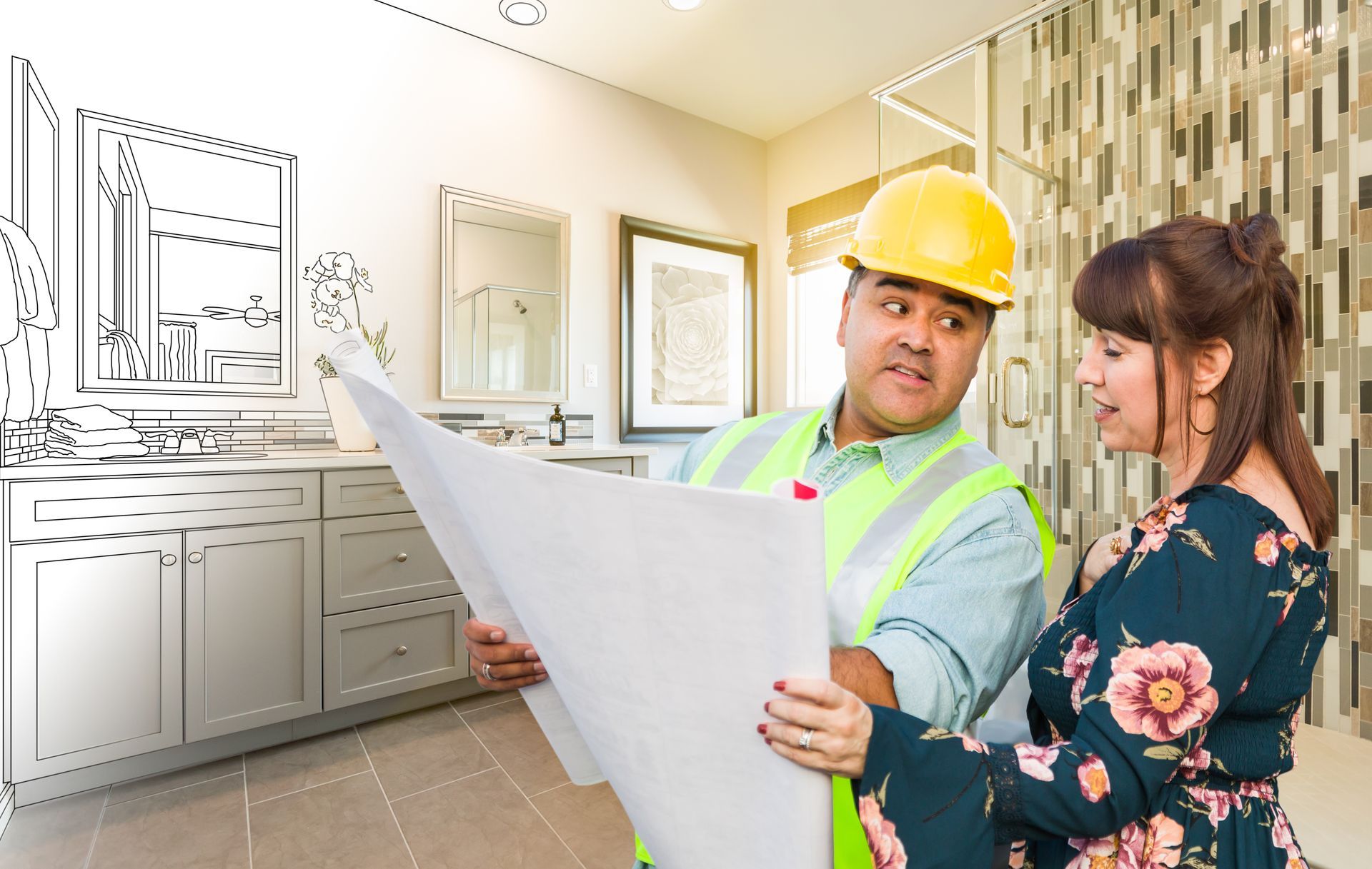 a contractor and a homeowner are looking at a blueprint of a bathroom remodel: Get a Bathroom Remodel Quote Vienna VA.