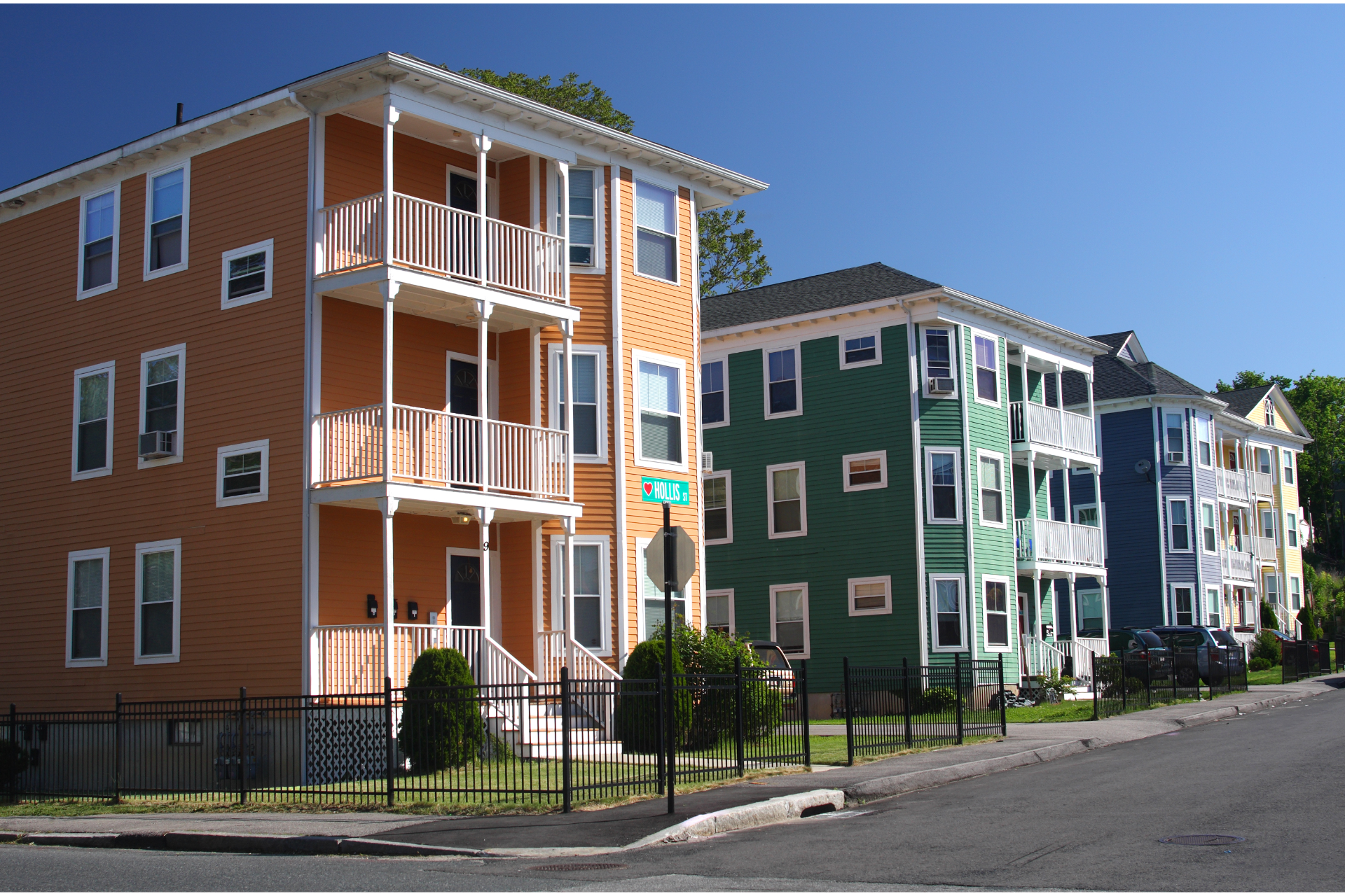 Colorful apartment buildings along a residential street on a sunny day