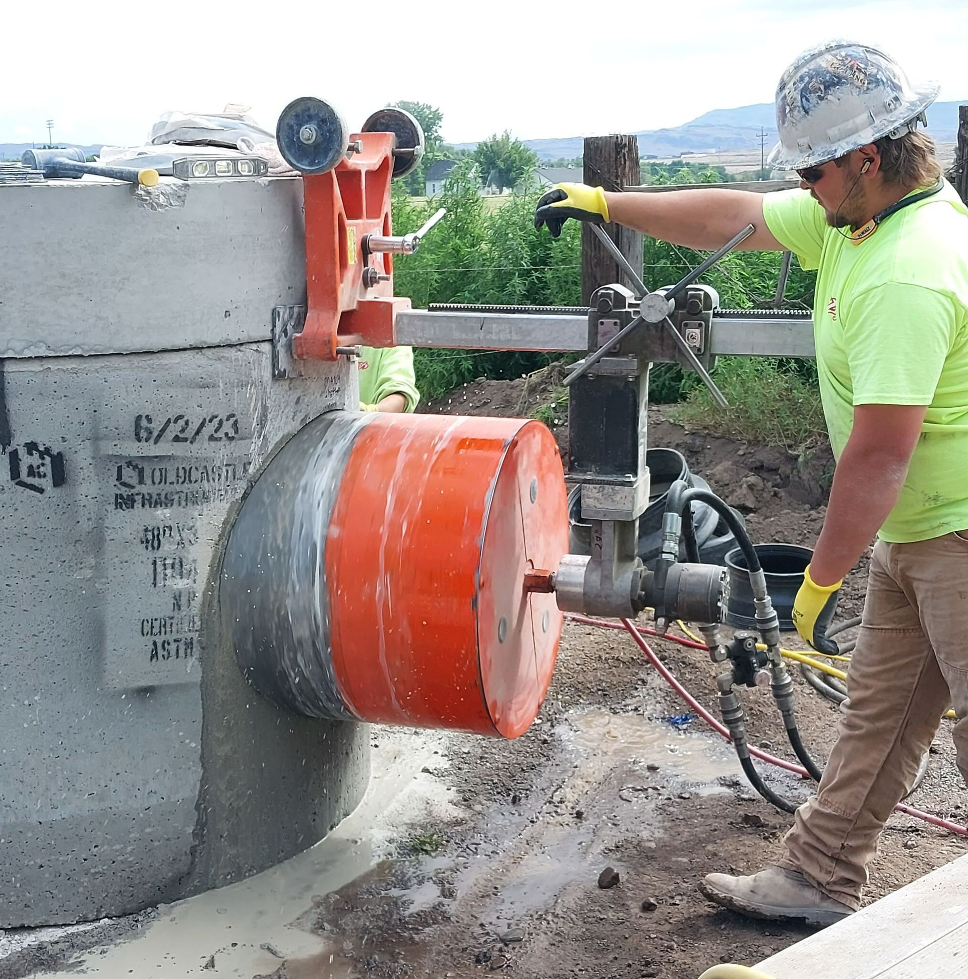 Worker Using Cutting Machine and Cutting Concrete — Caldwell, ID — ACDS Concrete Cutting