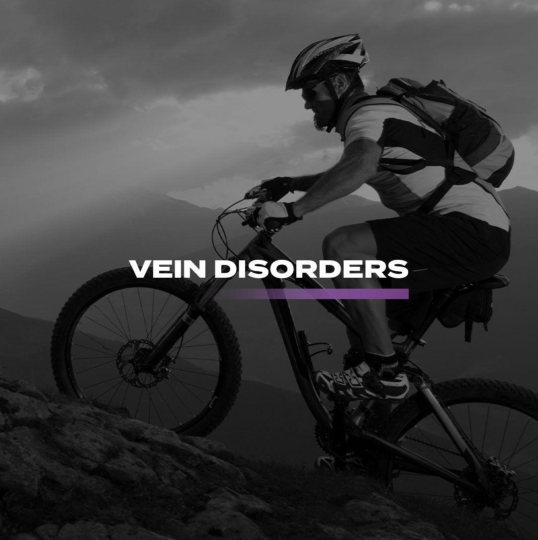 A man is riding a bike on top of a mountain with the words vein disorders above him.