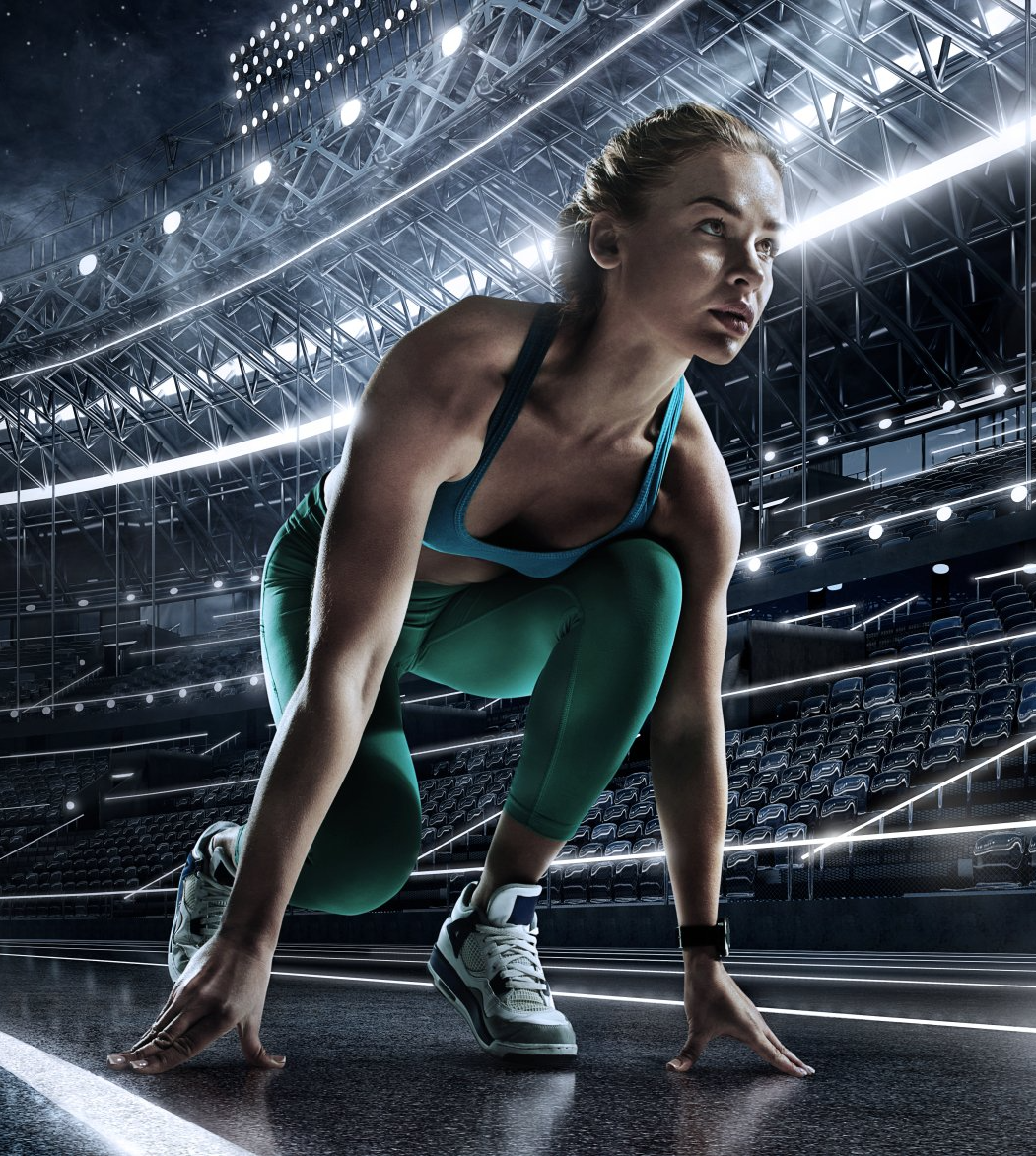 A woman is getting ready to run on a track
