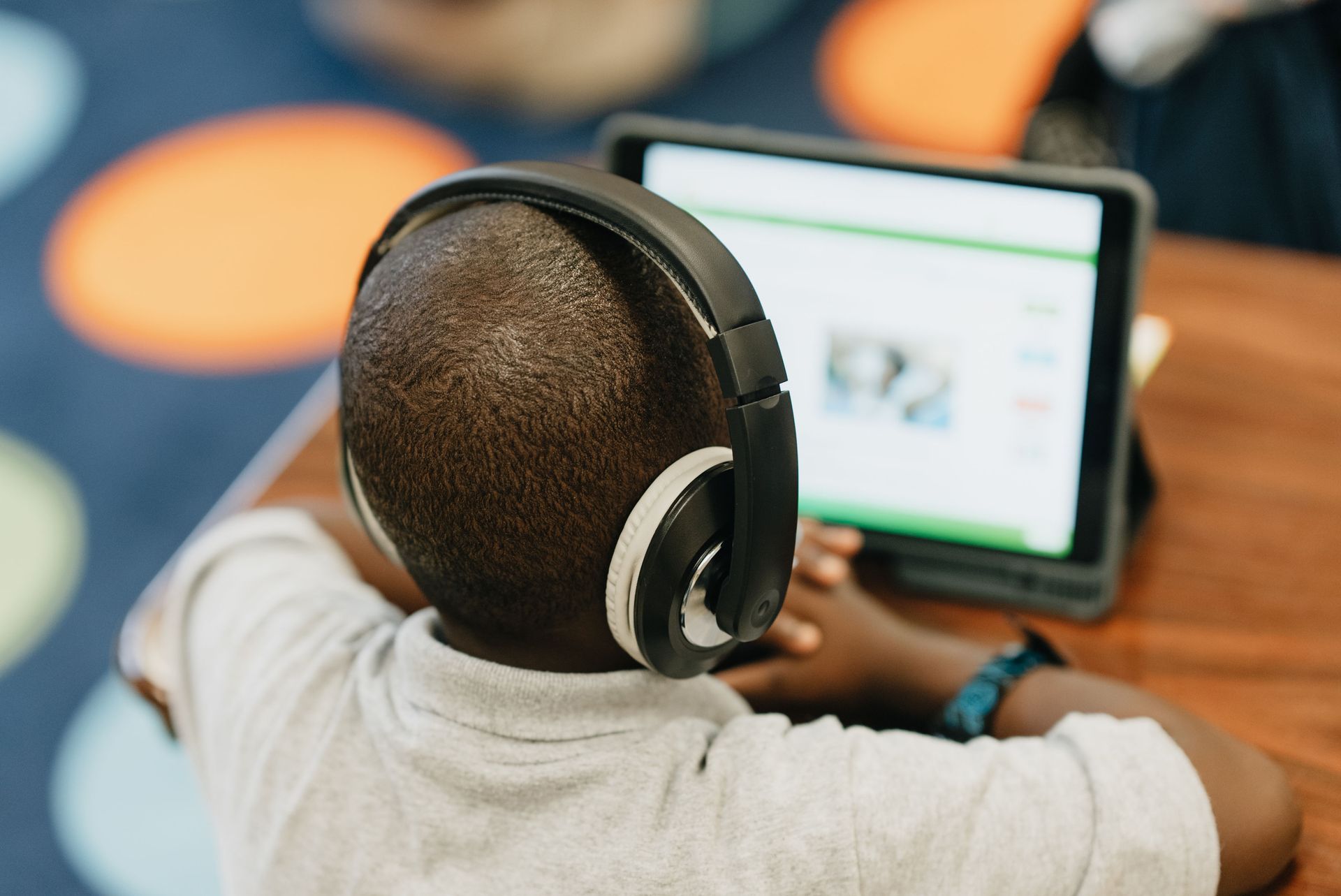 Students working with teachers in a classroom