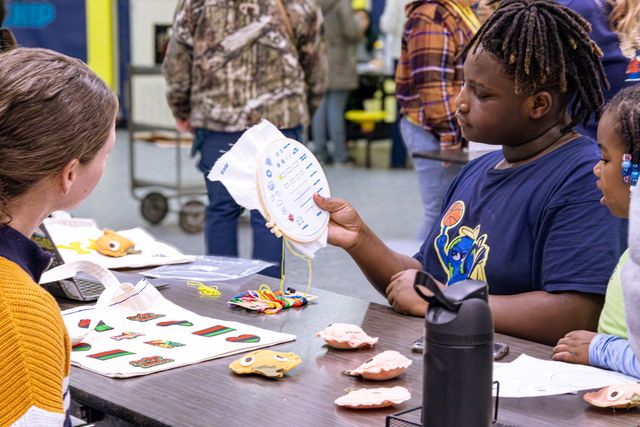 Students on stage at Winter Clubs Showcase.
