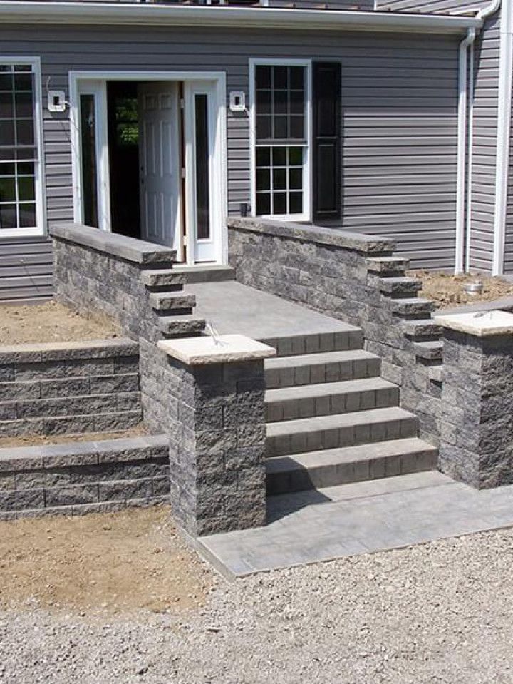 A house with stairs leading up to the front door
