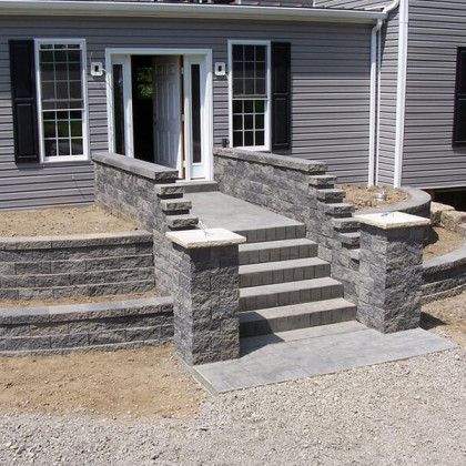A house with stairs leading up to the front door