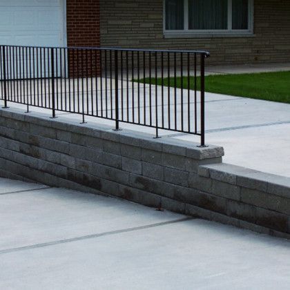 A concrete foundation is being built in a dirt field
