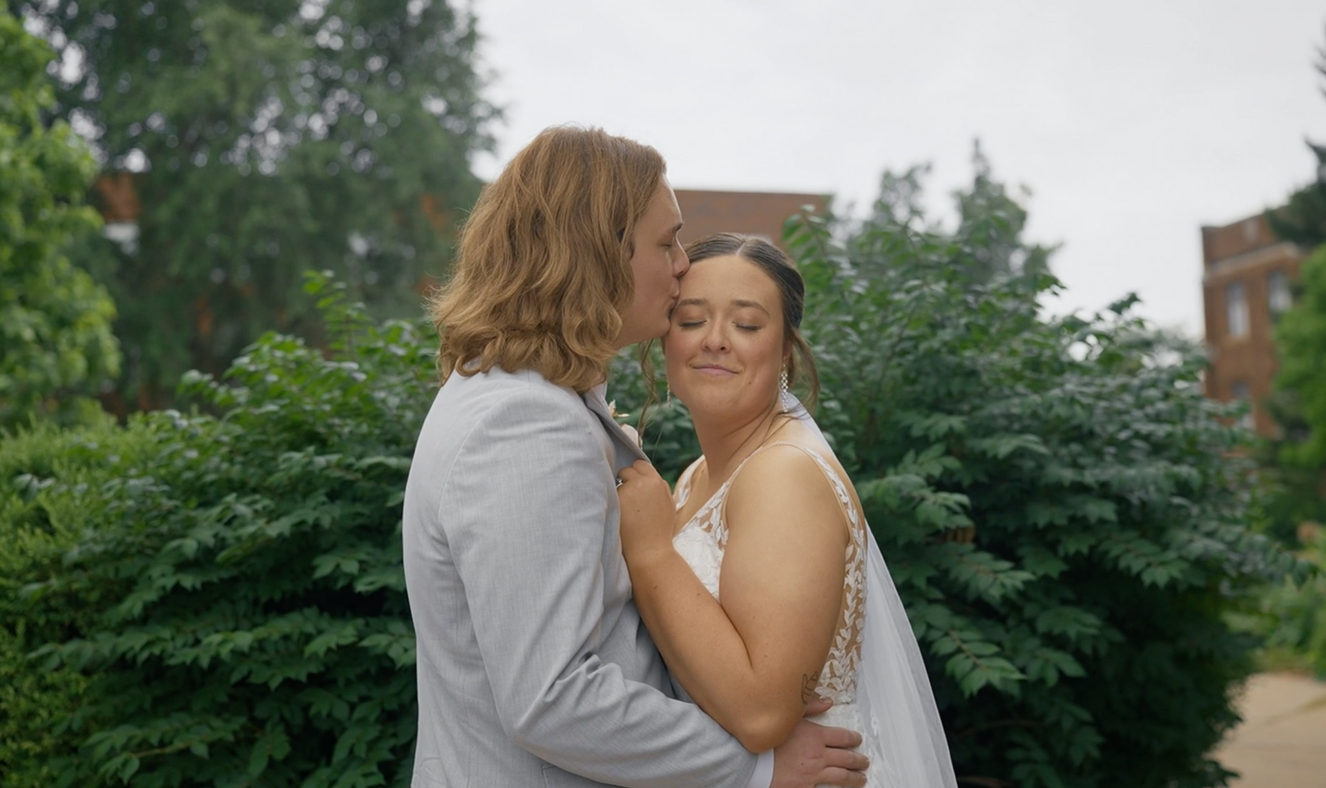 Bride and groom sharing a kiss on their wedding day.