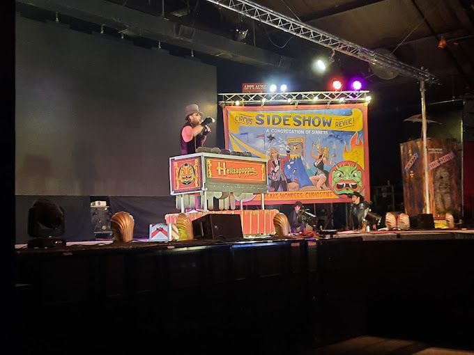 A stage with a sign that says sideshow on it.