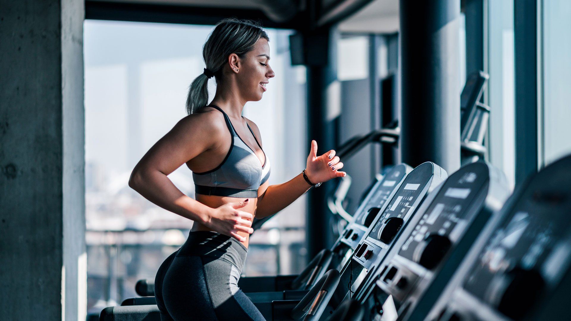 Woman Using a Treadmill — Miami, FL — Security Bond Associates, Inc.