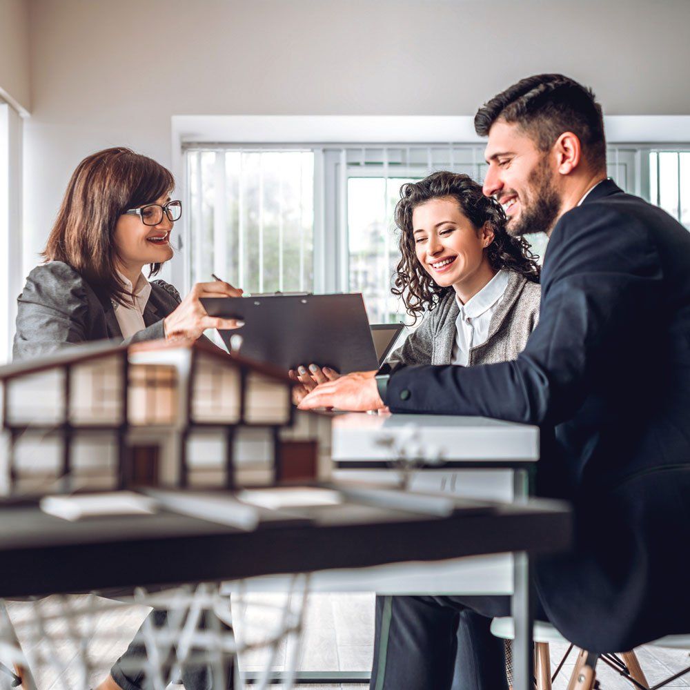 Woman Discussing Something to A Couple — Miami, FL — Security Bond Associates, Inc.