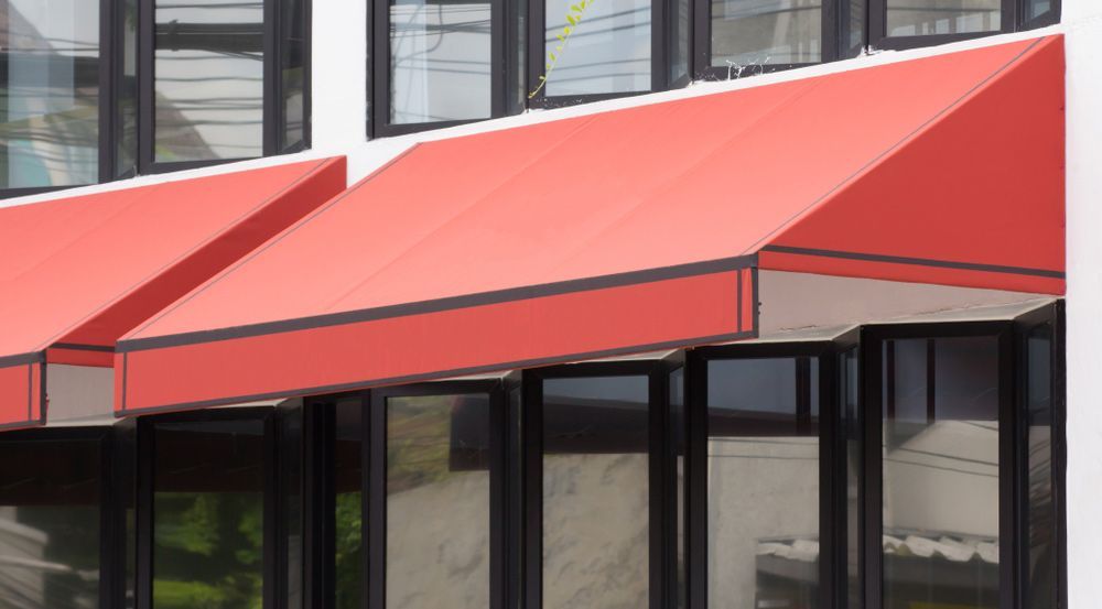 Awning Over Glass Windows And Black Aluminium Frame — Wholesale Window Coverings in Lake Macquarie, NSW