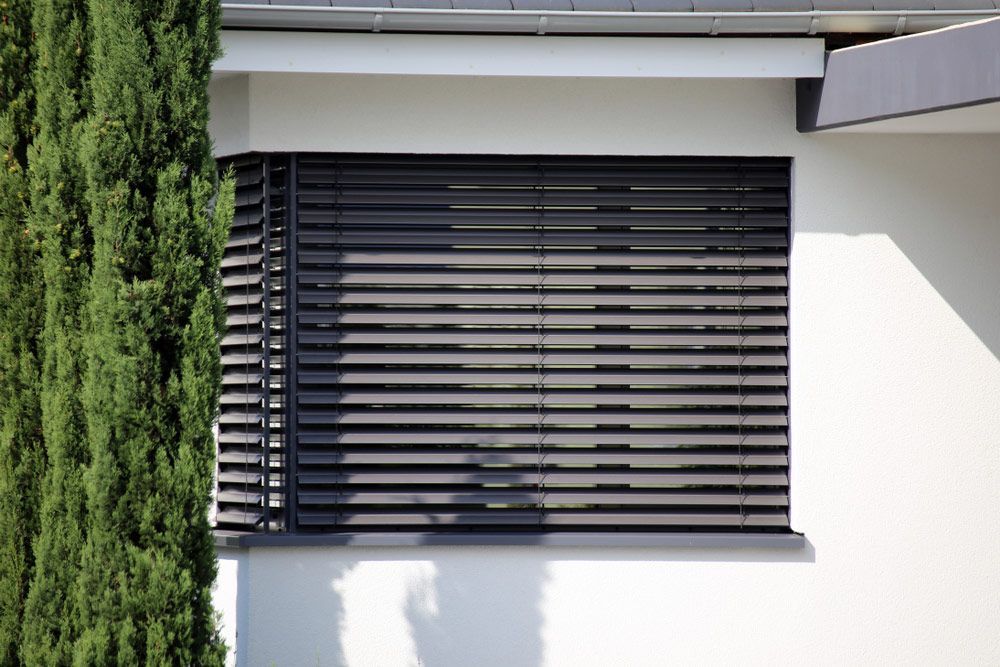 Window With Modern Blind Exterior In Home — Window Coverings in Cardiff, NSW