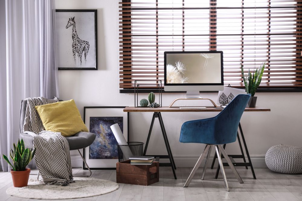 A Desk With a Computer Behind The Blinds — Window Coverings in Cardiff, NSW