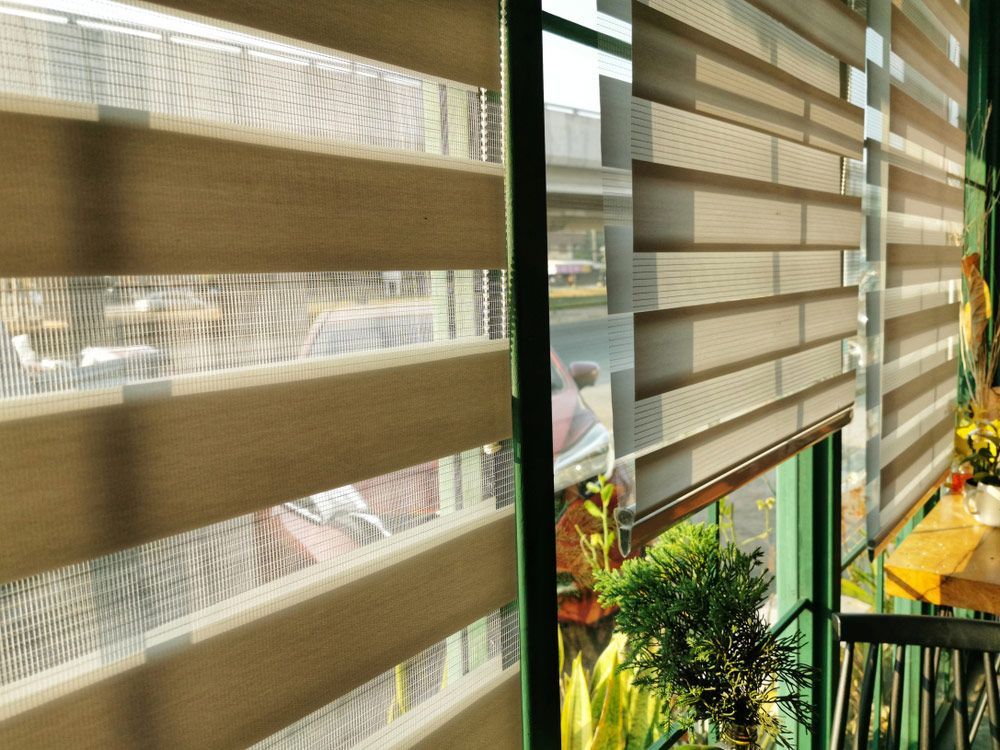 Roller Blinds Or Curtains At The Glass Window That Selected Point Focus — Window Coverings in Cardiff, NSW