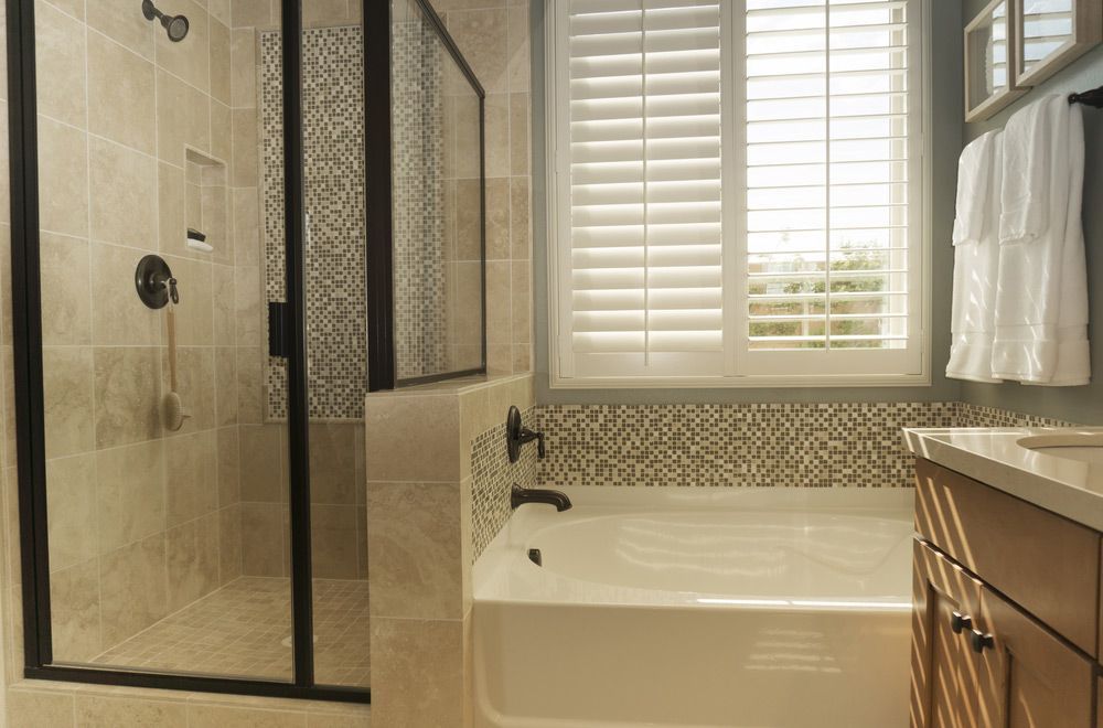 White Shutters In Bathroom Window — Wholesale Window Coverings in Port Stephens, NSW