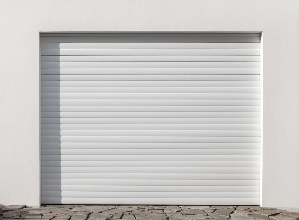 White Automatic Roller Shutter Gates — Window Coverings in Cardiff, NSW