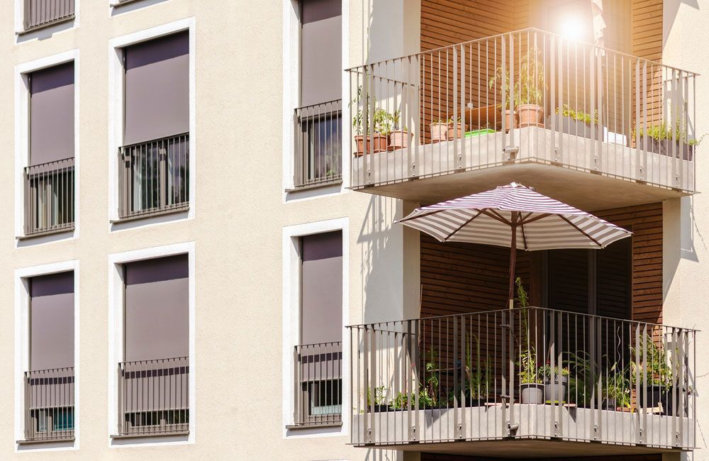 Modern Facade House With Windows And Balcony — Wholesale Window Coverings in Port Stephens, NSW