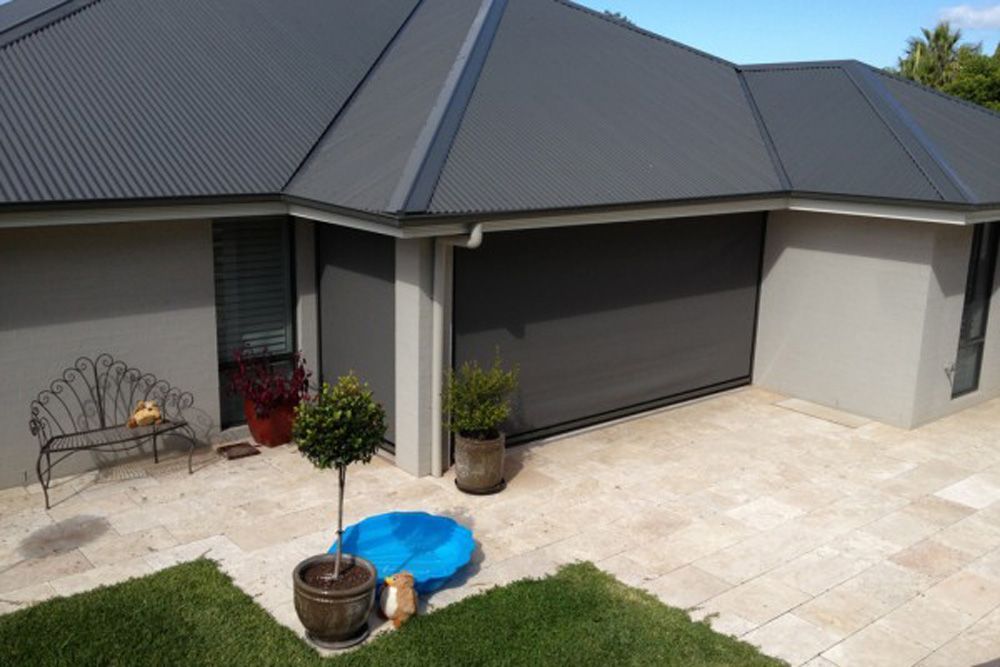 Side Left Outdoor Blinds In Home — Wholesale Window Coverings in Lake Macquarie, NSW