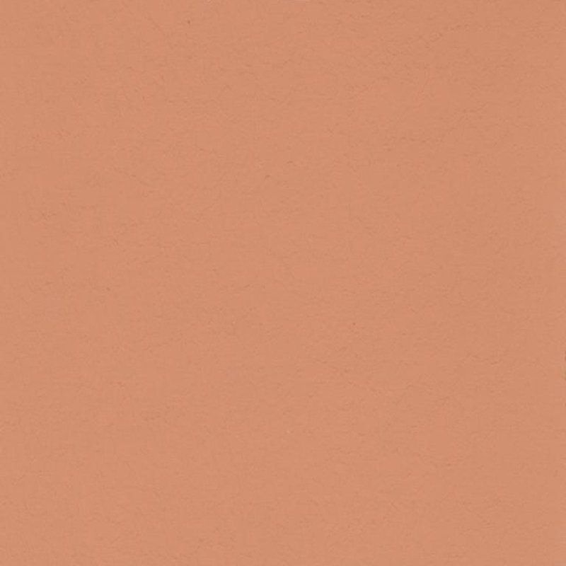 Eine Nahaufnahme einer pfirsichfarbenen Papierstruktur.