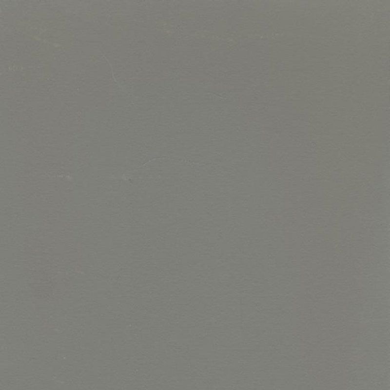 Eine Nahaufnahme eines grauen Hintergrunds mit einer einfachen Textur.