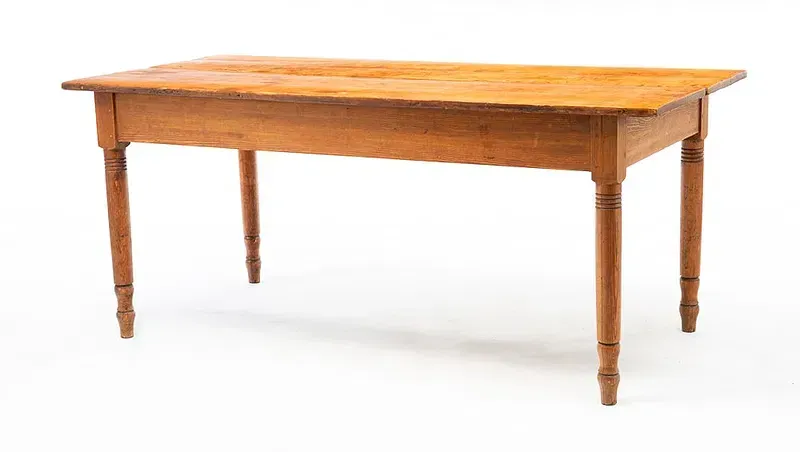 A wooden table with a wooden top and legs on a white background.