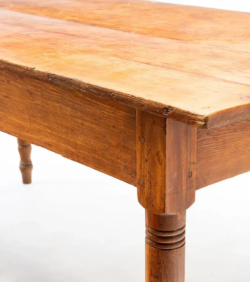 A close up of a wooden table on a white background