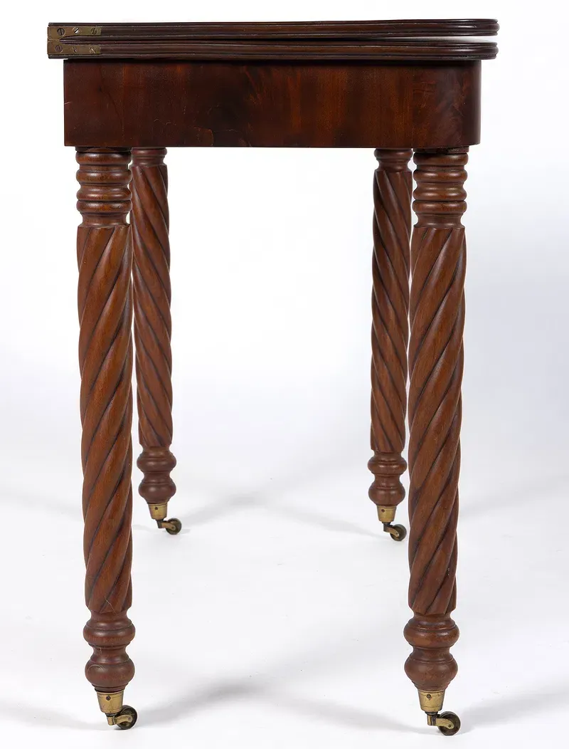 A close up of a wooden dresser with three drawers